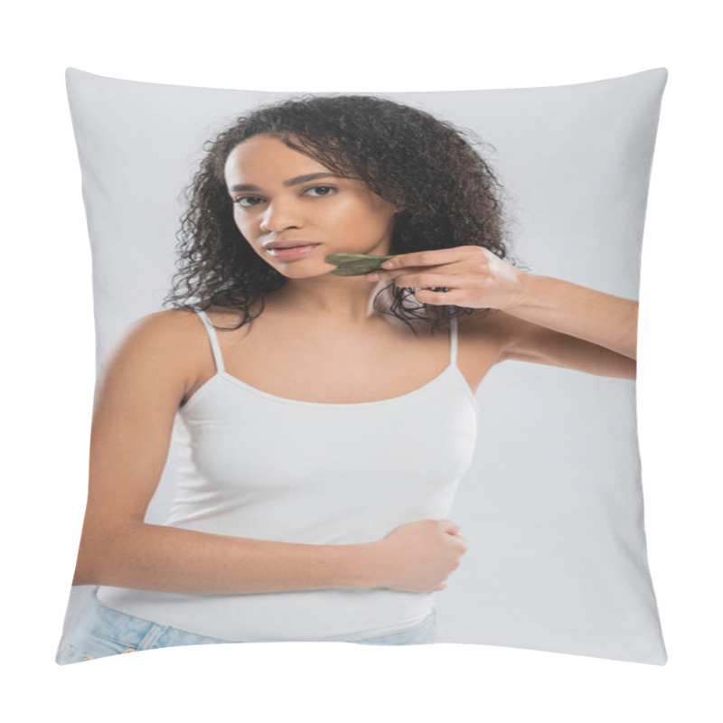 Personality  Young African American Woman In White Tank Top Using Face Scraper Isolated On Grey Pillow Covers