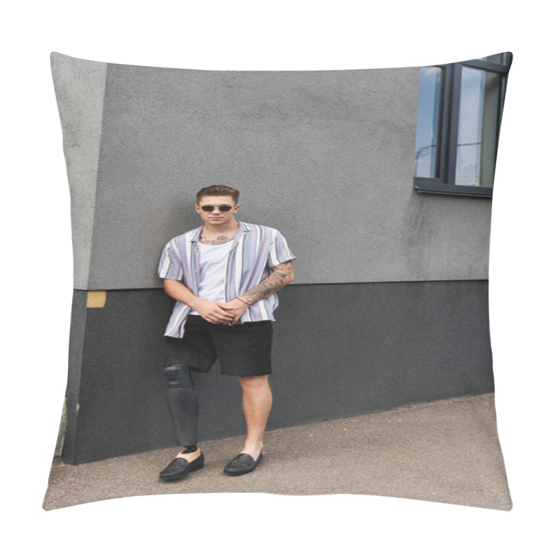 Personality  Young Man With A Prosthetic Leg Stands Confidently Against A Gray Wall, Wearing Casual Attire. Pillow Covers