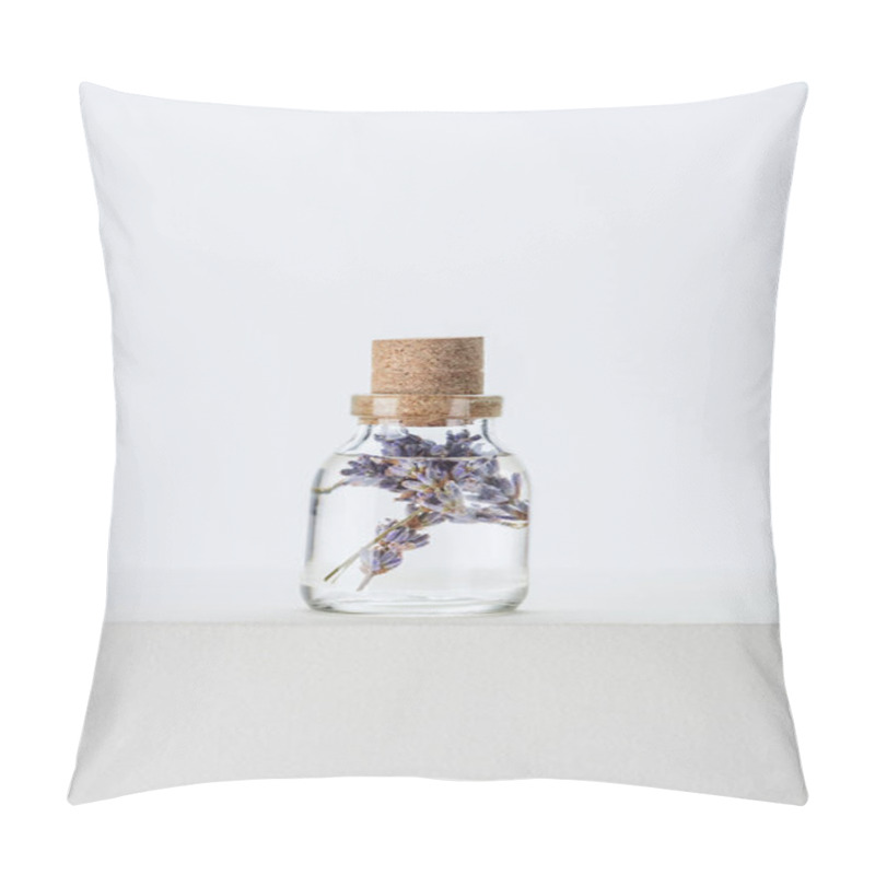 Personality  Bottle Of Natural Herbal Essential Oil With Violet Flowers On White Surface Pillow Covers