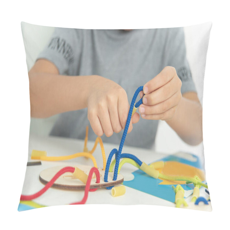 Personality  Close Up Of Child Hands Playing With Lace Or Rope And Pasta. Development Of Fine Motor Skills. Early Education, Montessori Method. Cognitive Skills, Pillow Covers