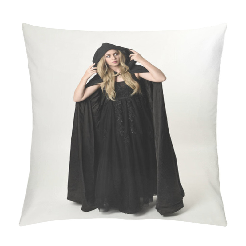 Personality  Full Length Portrait Of Blonde Girl Wearing Long Black Flowing Cloak, Standing Pose  With  A White Studio Background. Pillow Covers