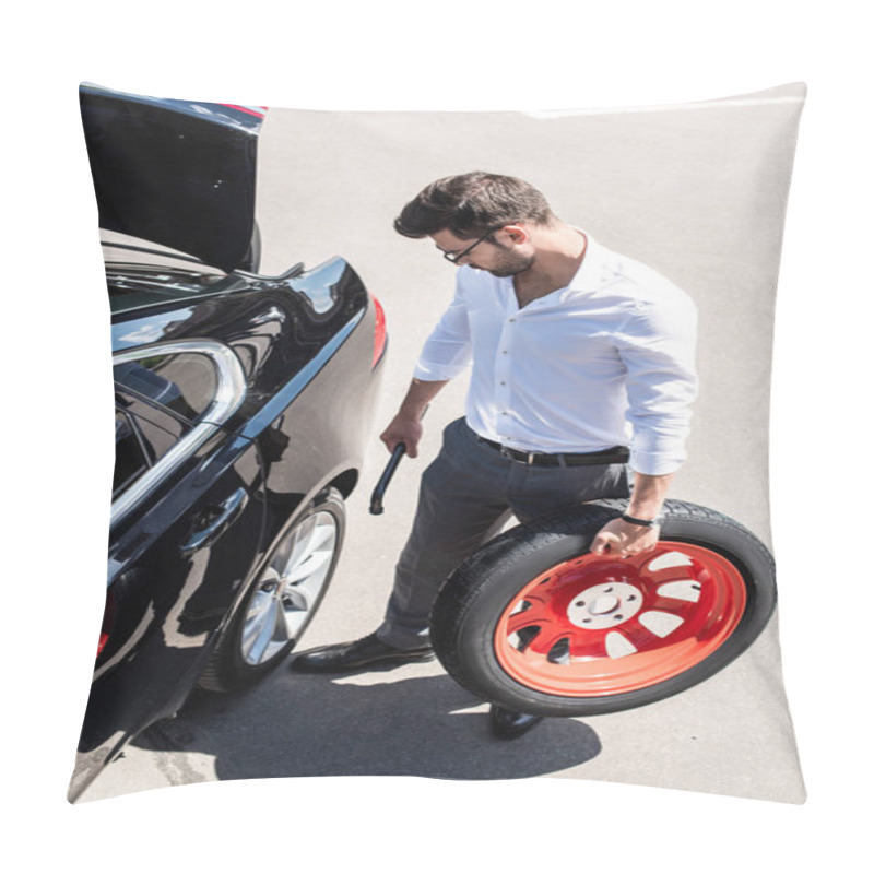 Personality  High Angle View Of Young Businessman In Eyeglasses Holding Wheel Spanner And Tire Near Car At Street Pillow Covers