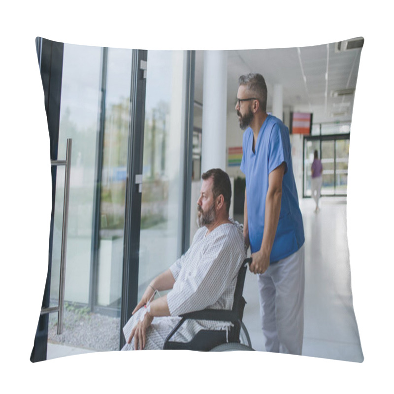 Personality  Male Nurse Pushing A Patient In Wheelchair Along A Hospital Corridor. Overweight Patient Feeling Anxious And Has Health Concerns. Pillow Covers