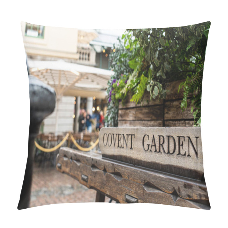 Personality  Close-up Of A Covent Garden Sign With Blurred Background Showing Outdoor Seating And Greenery, Capturing The Lively London Market Ambiance. Pillow Covers