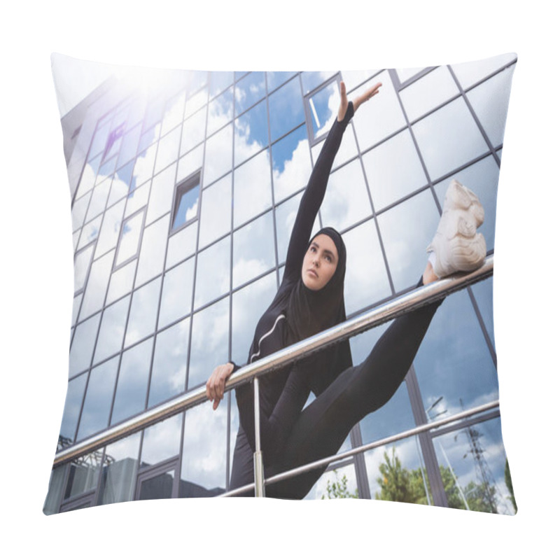 Personality  Low Angle View Of Muslim Woman In Hijab Holding Handrail While Exercising Near Modern Building  Pillow Covers