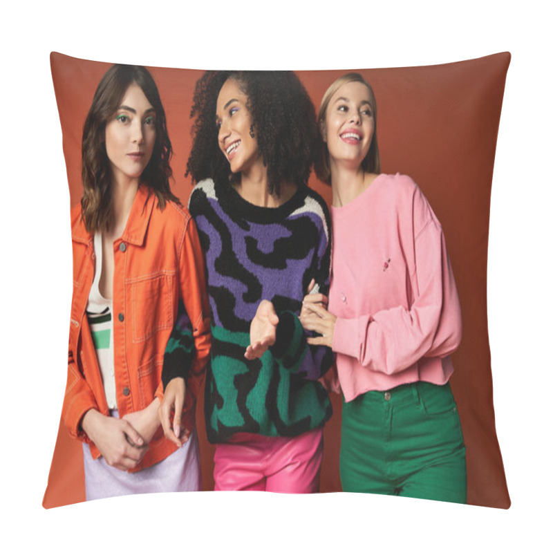 Personality  Three Young Women, Each Representing A Different Culture, Stand United In Stylish Outfits Against An Orange Backdrop. Pillow Covers