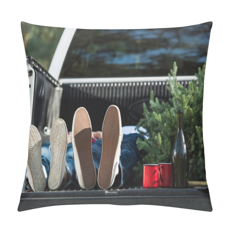 Personality  Selective Focus Of Young Couple Laying In Car Trunk With Christmas Tree And Champagne Bottle Outdoors  Pillow Covers