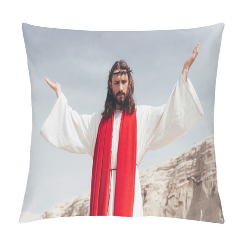 Personality  Low Angle View Of Jesus In Robe, Red Sash And Crown Of Thorns Standing With Raised Hands In Desert Pillow Covers