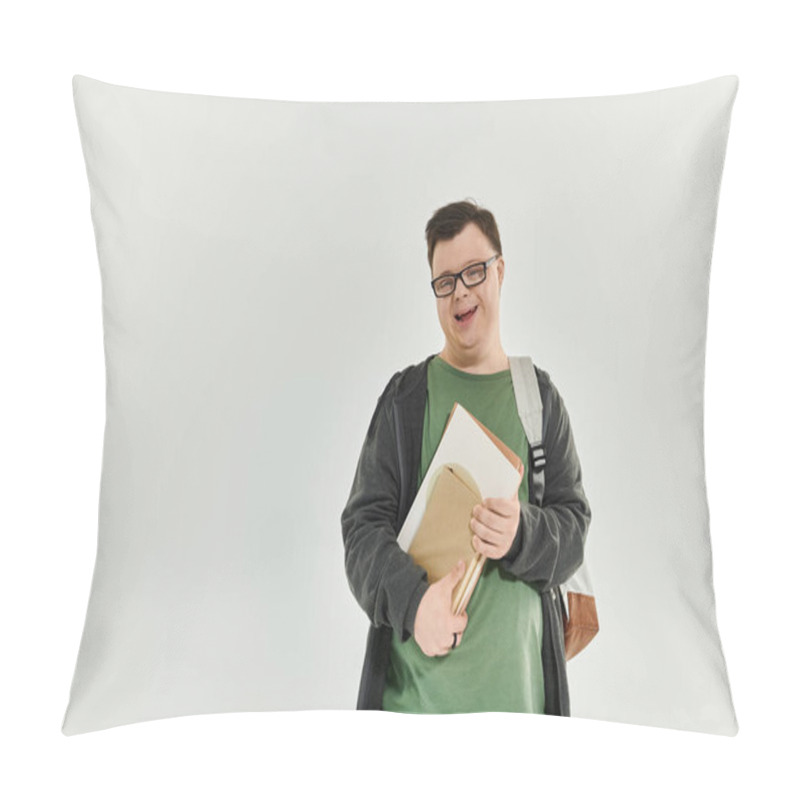 Personality  A Cheerful Man With Down Syndrome Stands At Home, Holding Books And Smiling Warmly. Pillow Covers