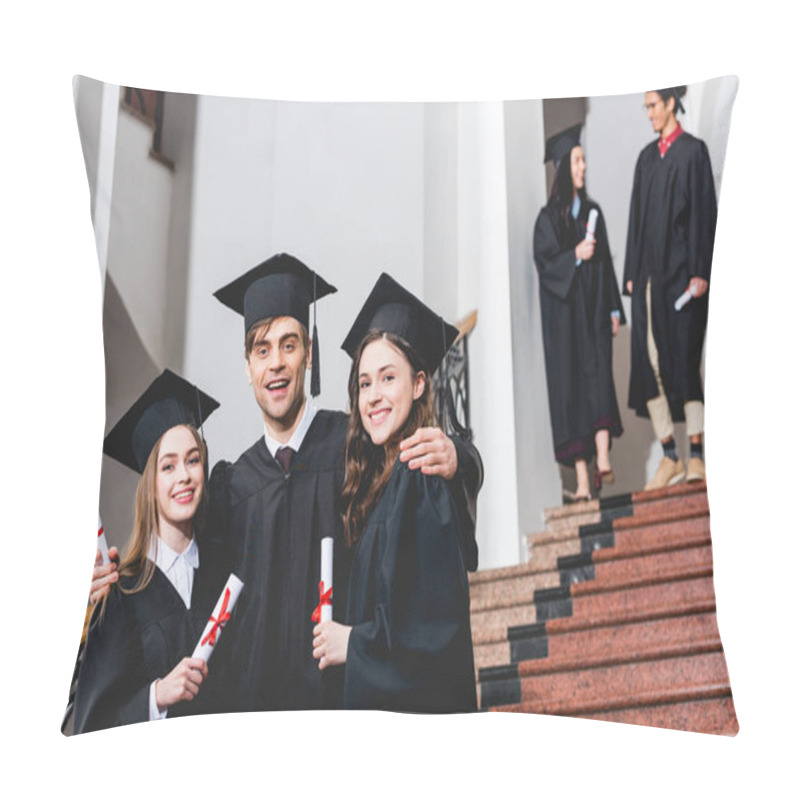 Personality  Selective Focus Of Cheerful Man In Graduation Cap Hugging Attractive Girls While Holding Diploma Near Students  Pillow Covers