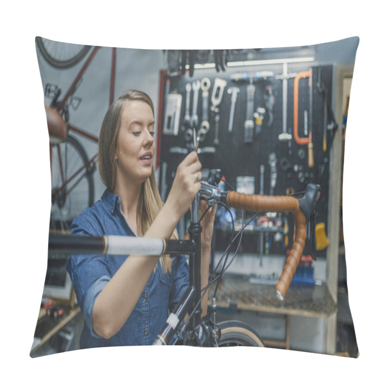 Personality  Woman Bicycle Mechanic Is Repairing A Bike In The Workshop. Technician Woman Fixing Bicycle In Repair Shop. Young Woman Adjusting Bike Chain And Repairing Bicycle. Bike Service.  Pillow Covers