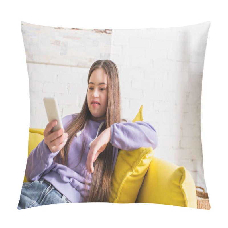 Personality  Smiling Teenager With Sown Syndrome Using Blurred Mobile Phone On Couch At Home  Pillow Covers