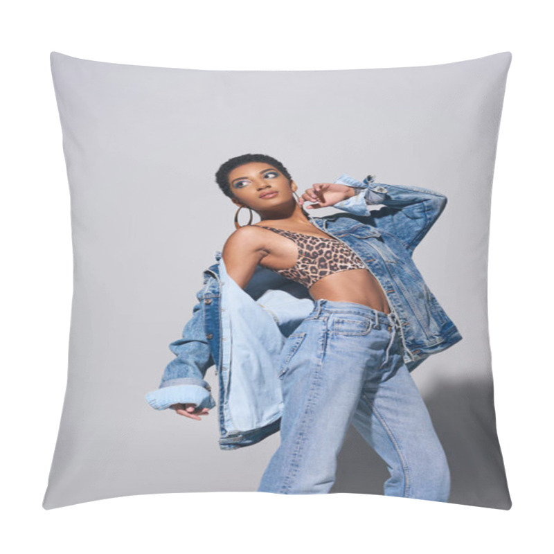 Personality  Fashionable African American Model With Short Hair, Vibrant Makeup And Golden Earrings Wearing Denim Jacket, Top And Jeans While Standing On Grey Background, Denim Fashion Concept Pillow Covers