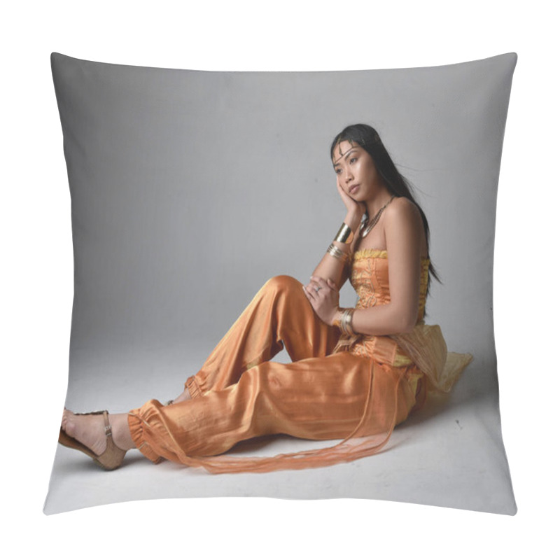 Personality  Full Length Portrait Of Pretty Young Asian Woman Wearing Golden Arabian Robes Like A Genie, Seated Pose, Isolated On Studio Background. Pillow Covers