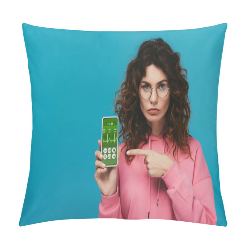 Personality  Attractive Curly Redhead Girl Pointing With Finger At Smartphone With E Health App On Screen Isolated On Blue  Pillow Covers