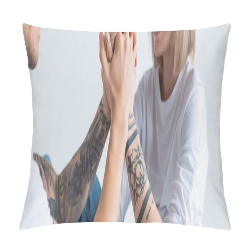 Personality  Cropped View Of Smiling Young Tattooed Woman Sitting With Husband On Floor And Holding Hands Isolated On Grey, Panoramic Shot Pillow Covers