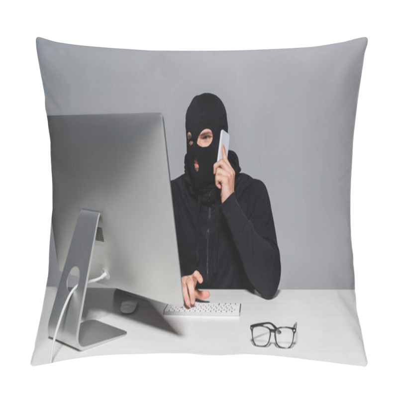 Personality  Hacker In Balaclava Talking On Smartphone And Using Computer Near Eyeglasses Isolated On Grey  Pillow Covers