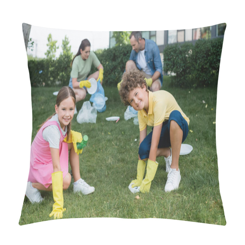 Personality  Smiling Kids In Rubber Gloves Holding Trash Near Blurred Mother And Dad On Lawn  Pillow Covers