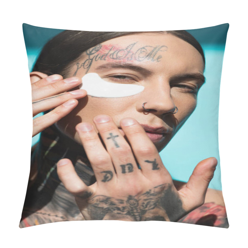 Personality  Tattooed Young Man Applying Eye Patch With Hands And Looking At Camera On Turquoise Pillow Covers