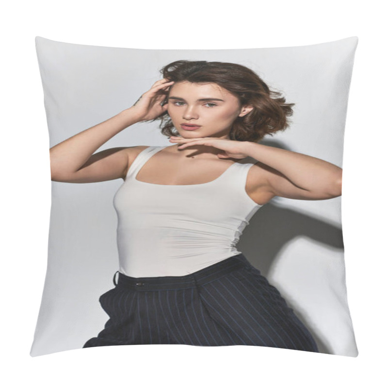 Personality  A Pretty Young Woman Posing Confidently In A White Tank Top And Black Pants In A Studio Setting On A Grey Background. Pillow Covers