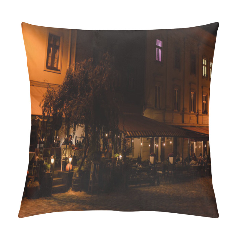 Personality  LVIV, UKRAINE - OCTOBER 23, 2019: People Sitting In Cafe With Terrace In Evening  Pillow Covers