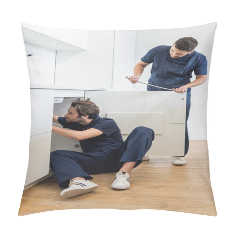 Personality  Workman Holding Metal Hose Near Plumber Working On Floor In Kitchen Pillow Covers