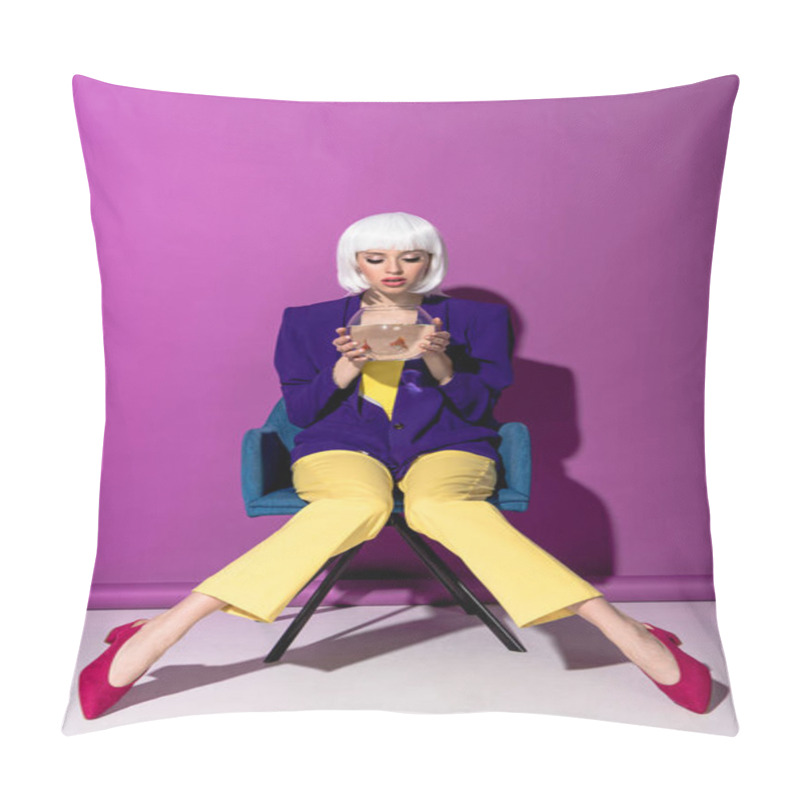 Personality  Glamorous Woman In Wig Sitting In Armchair And Looking In Aquarium With Goldfishes On Purple Background Pillow Covers