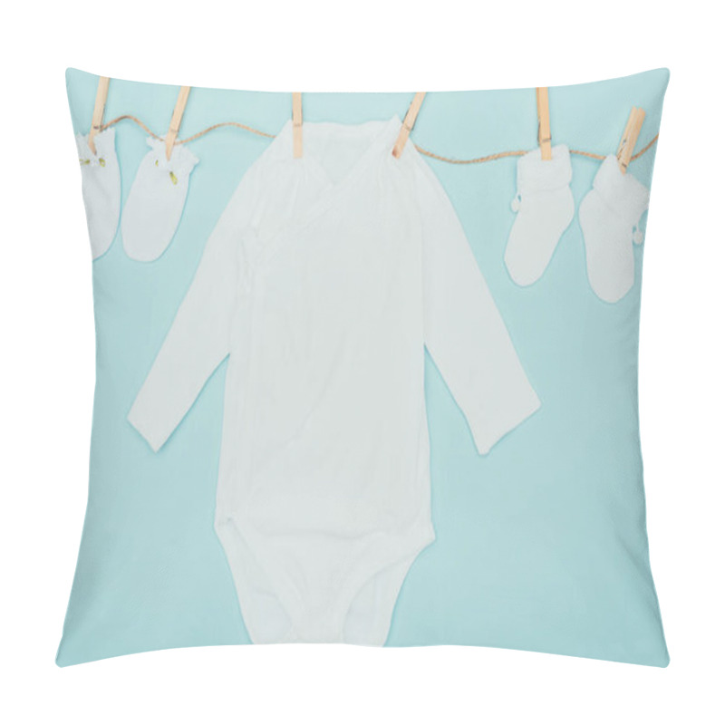 Personality  Top View Of Baby Bodysuits And Socks Drying On Rope Isolated On Blue Pillow Covers