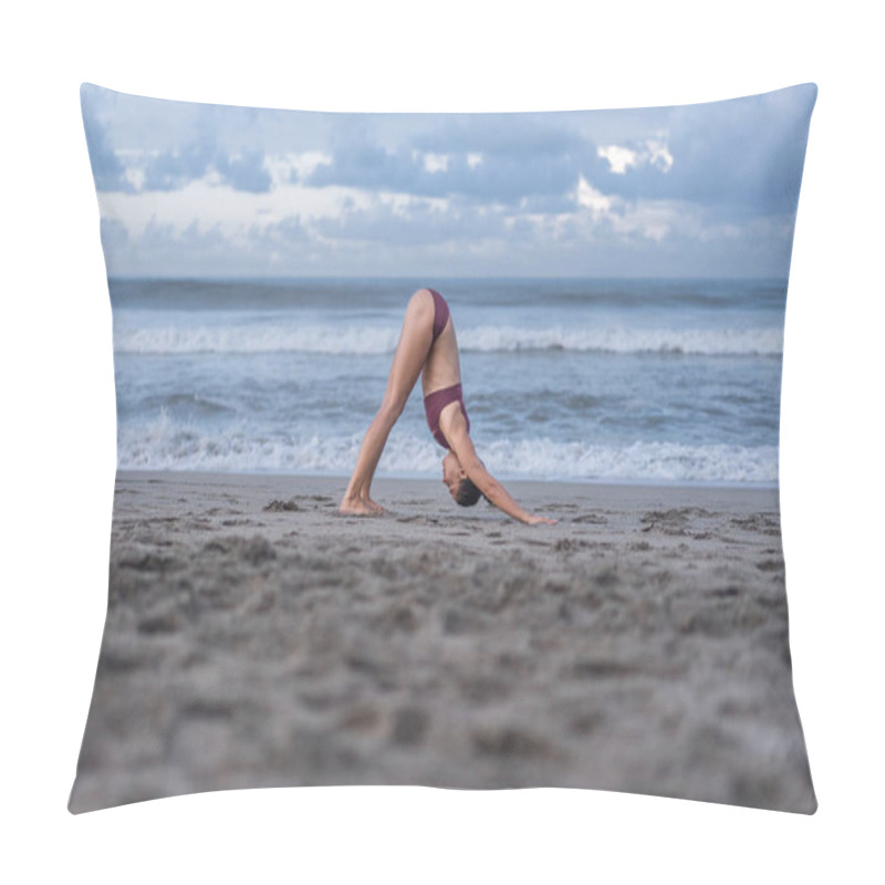 Personality  Side View Of Attractive Young Woman Practicing Yoga In Downward-Facing Dog Pose (Adho Mukha Svanasana) On Seashore Pillow Covers