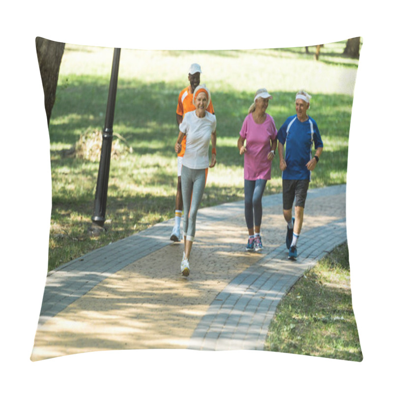 Personality  Selective Focus Multicultural Retired Women And Men In Sportswear Jogging In Walkway In Park  Pillow Covers