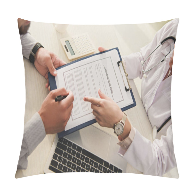 Personality  Cropped View Of Client Signing Insurance Claim Form While Doctor Pointing At It In Clinic With Laptop And Calculator Pillow Covers