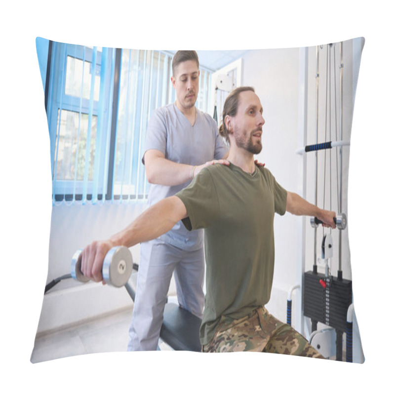 Personality  Exhausted Patient Diligently Performs Special Exercises With Dumbbells Under The Supervision Of An Instructor In A Rehabilitation Room Pillow Covers