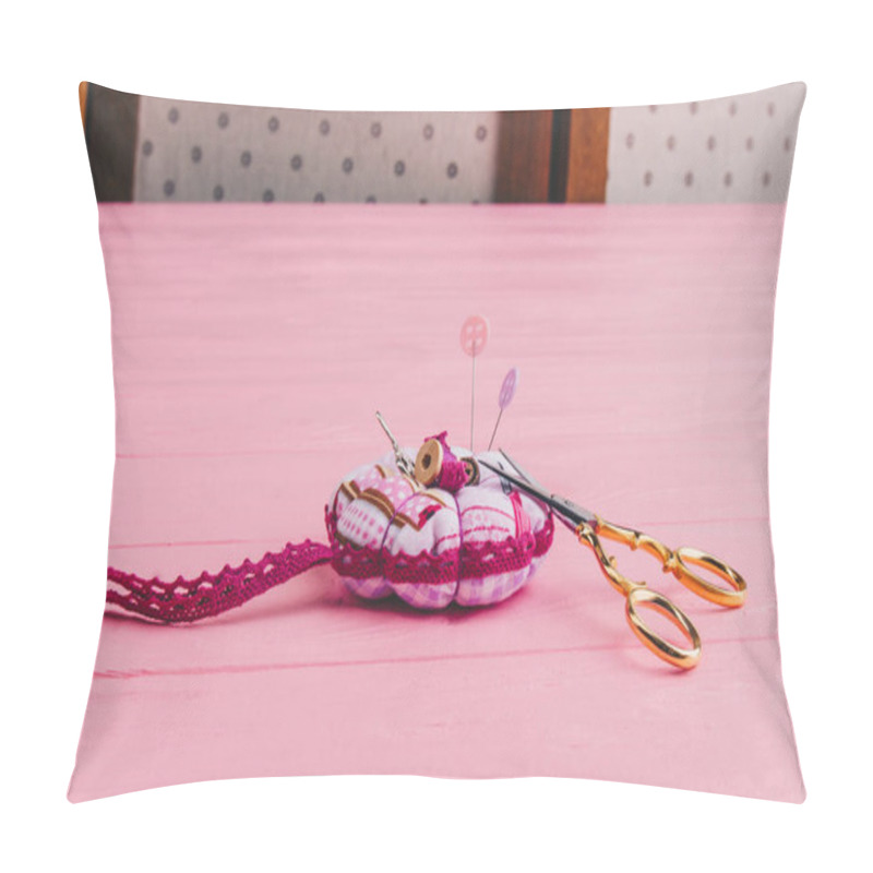 Personality  A Pincushion Rests On Pink Boards. Iron Scissors For Needlework Lie Next To Needles Stuck In A Sectional Pillow Pillow Covers