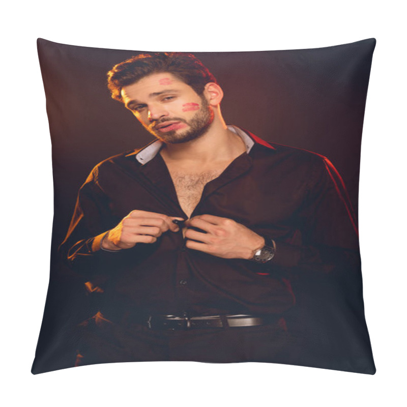 Personality  Handsome Man With Lipstick Prints On Face Looking At Camera And Unbuttoning Shirt Isolated On Black Pillow Covers