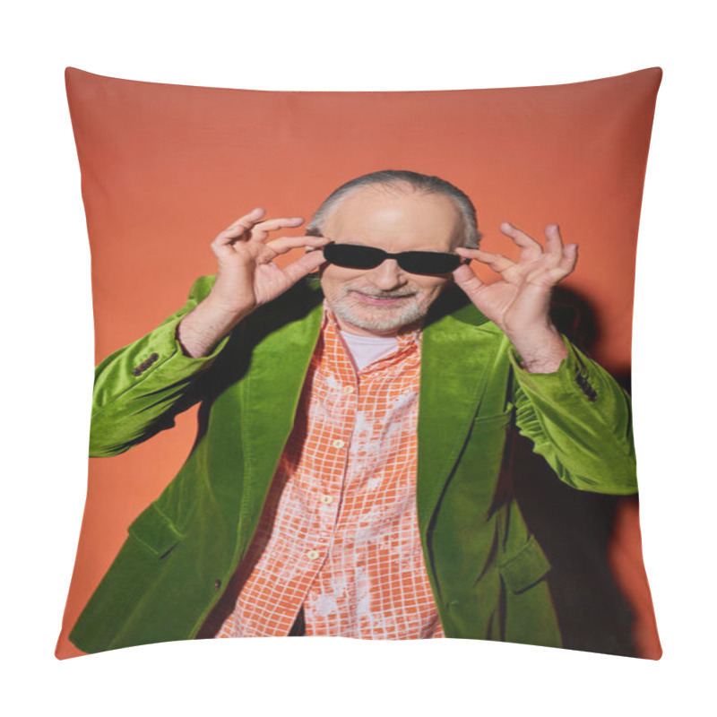 Personality  Optimistic Senior Man With Groomed Beard Adjusting Dark Sunglasses And Smiling At Camera On Red And Orange Background, Fashion Look, Green Velour Blazer, Happy And Stylish Aging Concept Pillow Covers