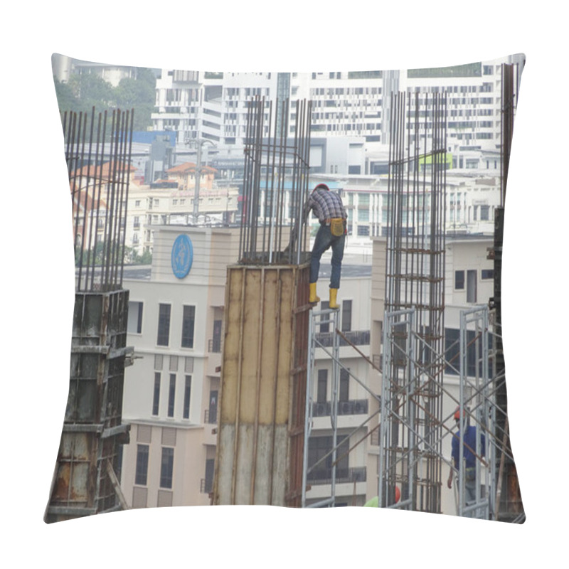 Personality  KUALA LUMPUR, MALAYSIA -AUGUST 10, 2017: Construction Workers Working At Height At The Construction Site. They Are Requested To Wear Appropriate Safety Gear To Prevent Bad Happen To Them.  Pillow Covers