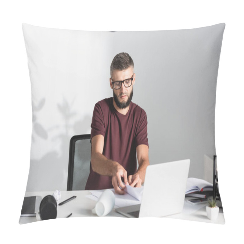 Personality  Businessman Holding Papers Near Laptop, Cup And Clumped Paper On Table  Pillow Covers