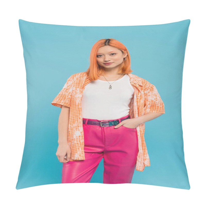 Personality  Casual Attire, Young Asian Woman With Dyed Red Hair Standing With Hand In Pocket Of Pink Pants On Vibrant Blue Background, Orange Shirt, Personal Style, Confidence, Generation Z  Pillow Covers