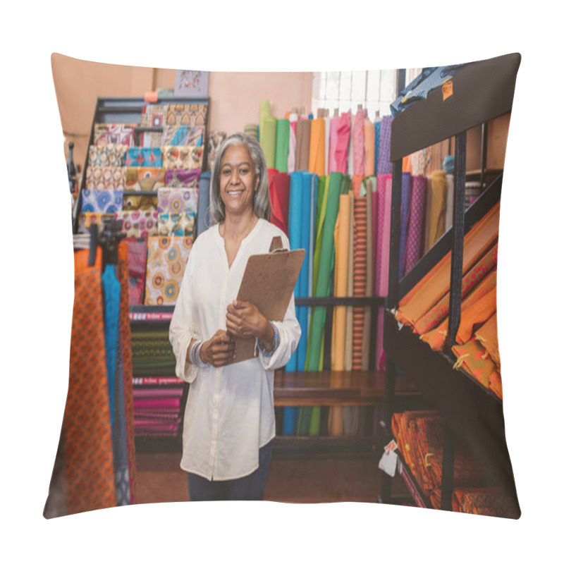 Personality  Portrait Of A Smiling Mature Fabric Shop Owner Holding A Clipboard While Standing Next To Racks Of Colorful Cloths And Textiles  Pillow Covers