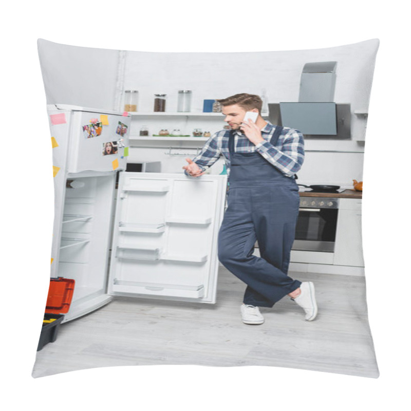 Personality  Full Length Of Young Repairman Talking On Smartphone While Leaning On Fridge Near Toolbox In Kitchen Pillow Covers