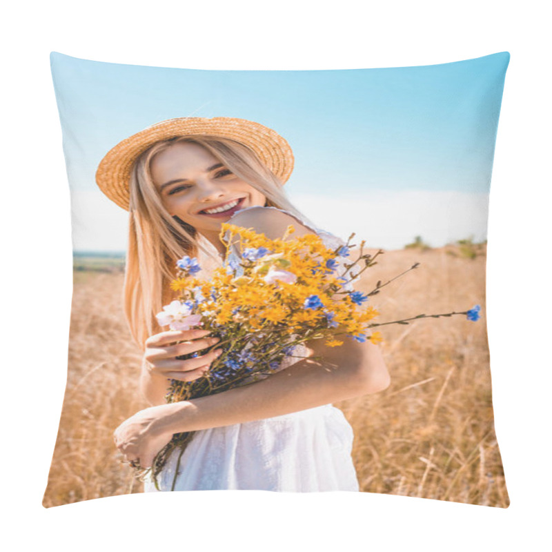 Personality  Young Stylish Woman In Straw Hat Holding Wildflowers While Looking At Camera In Grassy Field Pillow Covers