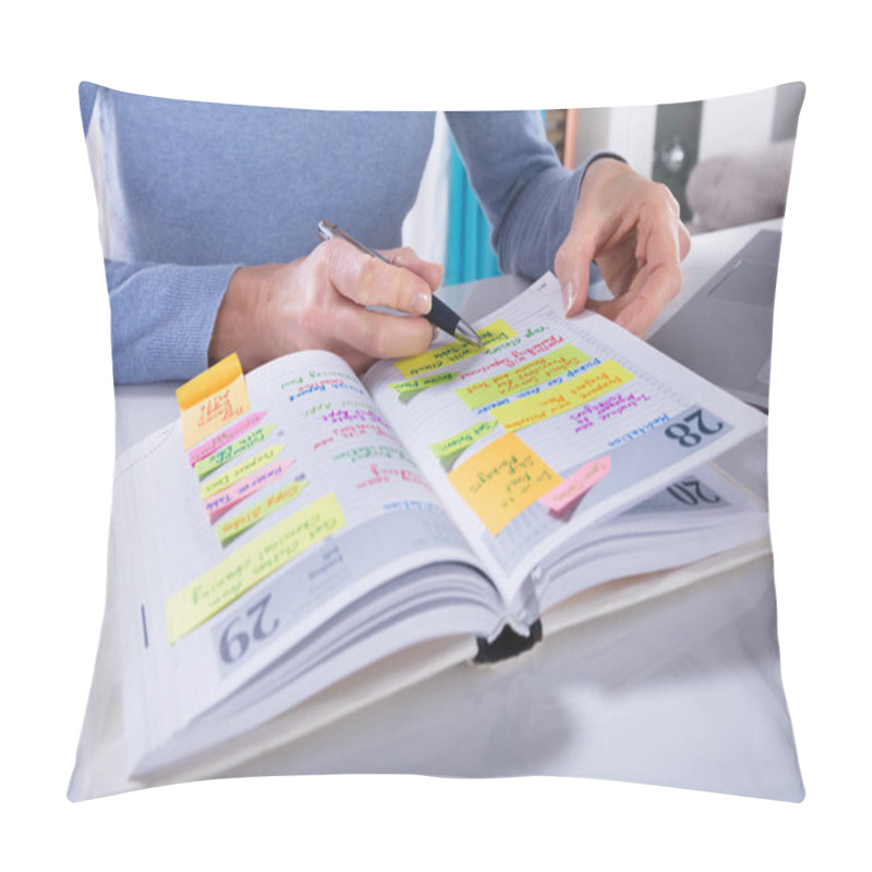 Personality  Close-up Of A Woman Writing Schedule In Calendar Diary On White Desk Pillow Covers