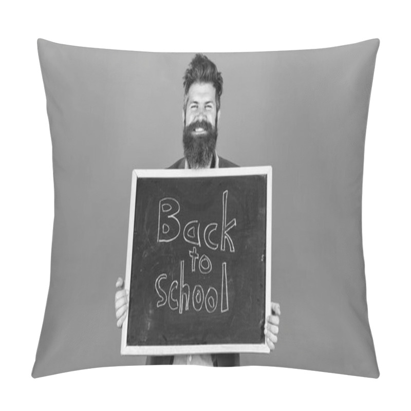 Personality  New Semester In School. Teacher Bearded Man Stands And Holds Blackboard With Inscription Back To School Blue Background. Teacher Invites To Continue Studying. Continue Your Education With Us Pillow Covers