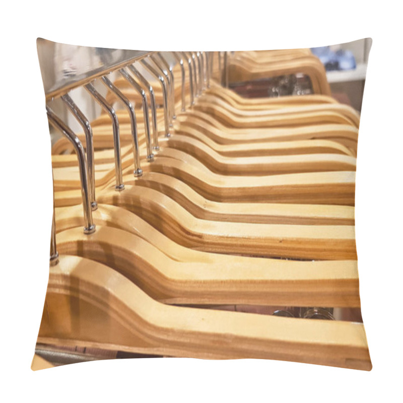 Personality  Detail Of Clothes Hanging On Wooden Hangers In A Fashion Store. Pillow Covers