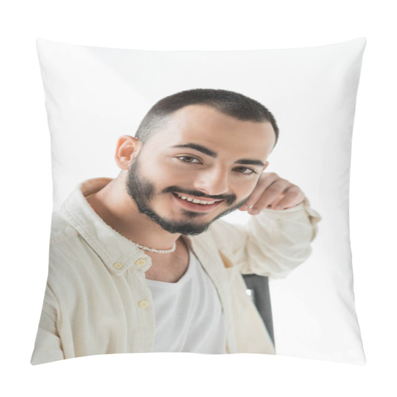 Personality  Portrait Of Cheerful Bearded Homosexual Man In Everyday Clothes Made Of Natural Fabrics And Pearl Necklace Looking At Camera While Sitting On Chair On Grey Background Pillow Covers