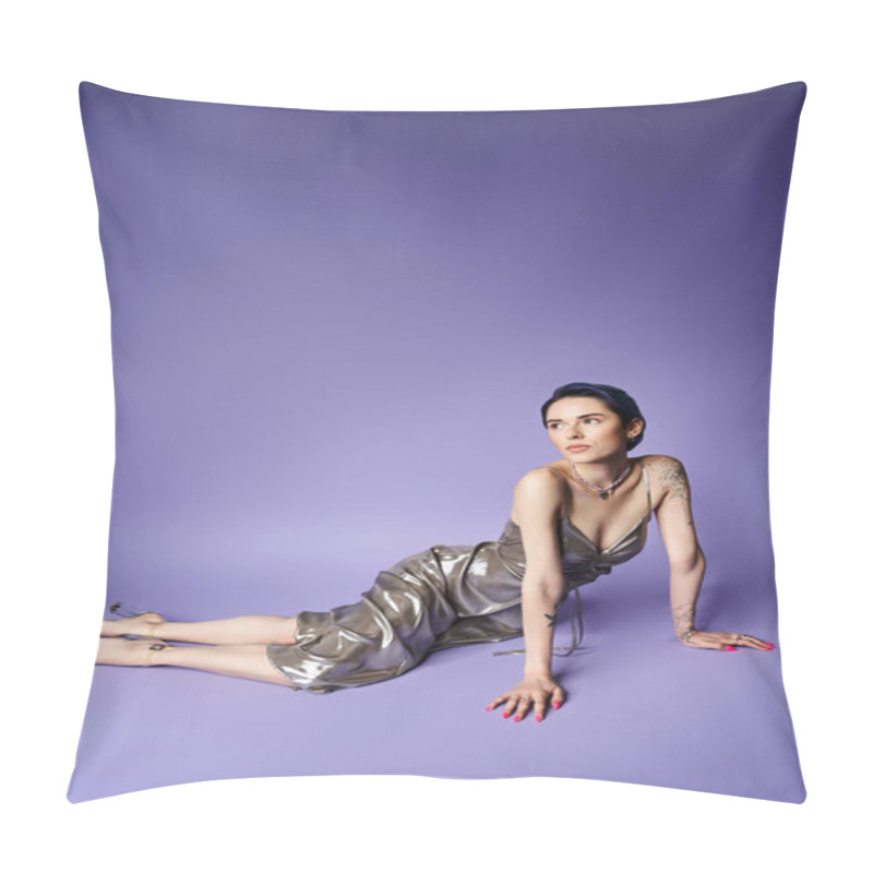 Personality  A young woman with short blue hair, wearing a silver dress, lies gracefully on the ground in a studio setting, exuding elegance. pillow covers