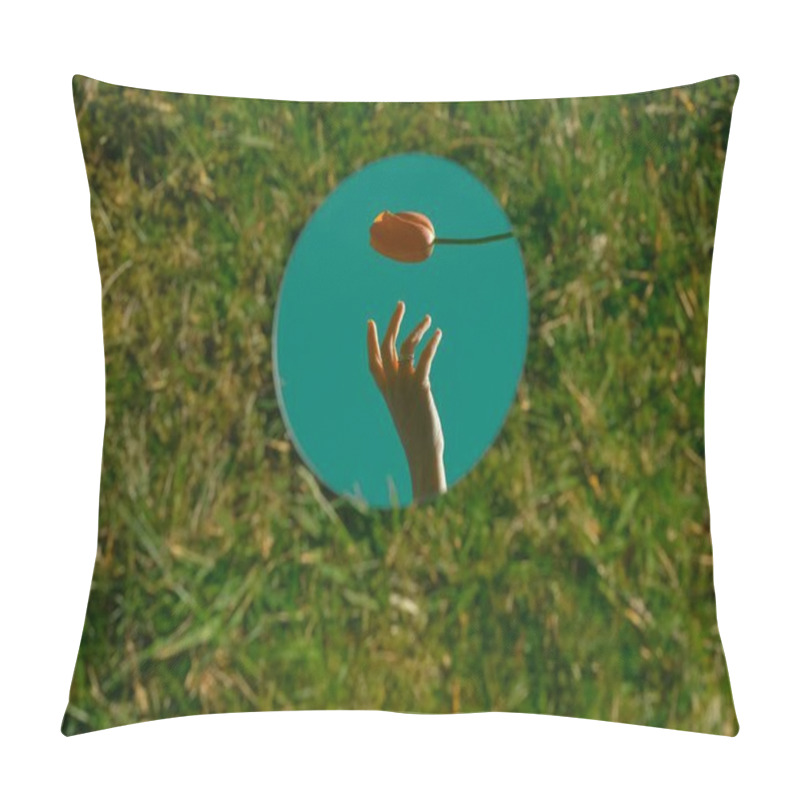 Personality  A Delicate Hand Reaching For A Tulip Reflected In A Mirror On Green Grass. Pillow Covers