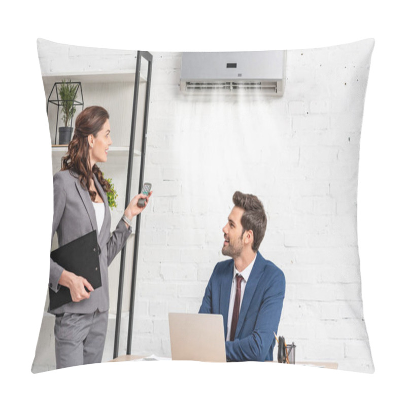 Personality  Smiling Businesswoman Holding Remote Control While Standing Near Handsome Manager Sitting At Workplace Under Air Conditioner Pillow Covers