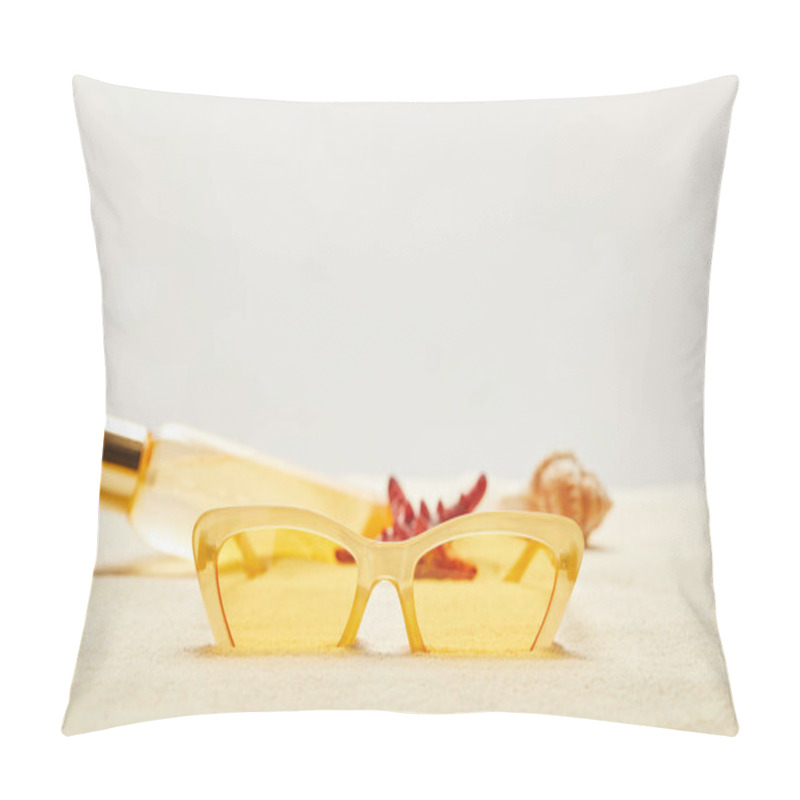 Personality  Selective Focus Of Yellow Sunglasses Near Suntan Oil Bottle On Golden Sand Isolated On Grey Pillow Covers