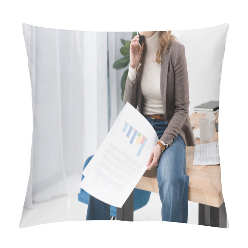 Personality  Cropped Shot Of Businesswoman With Papers Talking On Smartphone While Sitting On Table In Office Pillow Covers